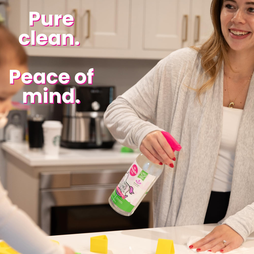 Dapple being sprayed on a toy with quick wipe benefit for parents