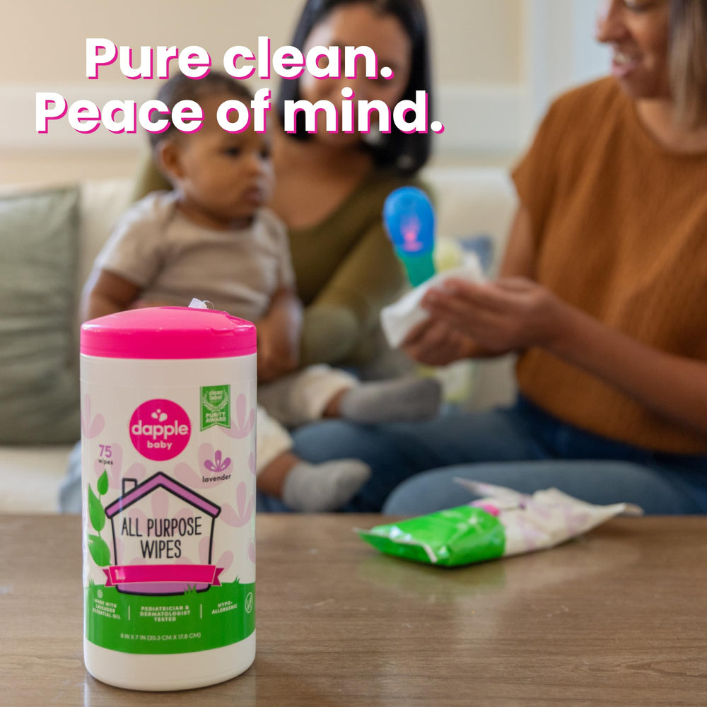 Dapple wipe cleaning a highchair surface demonstrating safe baby gear cleaning