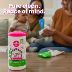 Dapple wipe cleaning a highchair surface demonstrating safe baby gear cleaning
