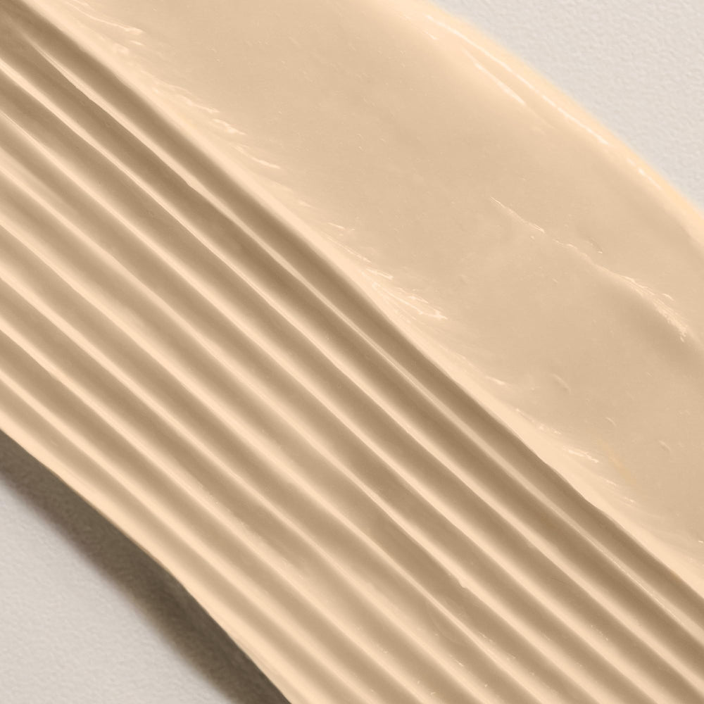 Davines NOUNOU being applied to damp hair to show improved detangling benefits