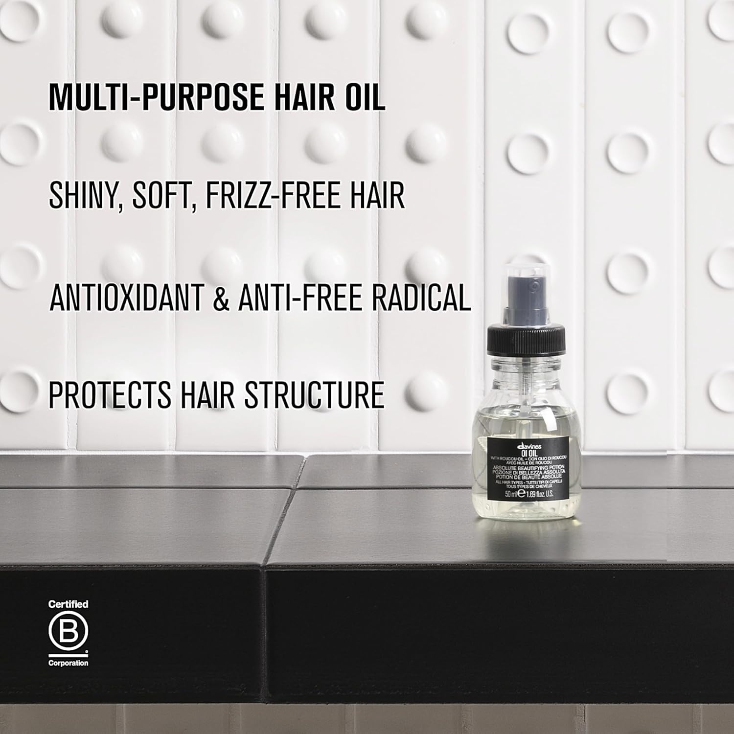 Davines OI Oil ingredients label closeup highlighting Roucou oil nourishing benefit