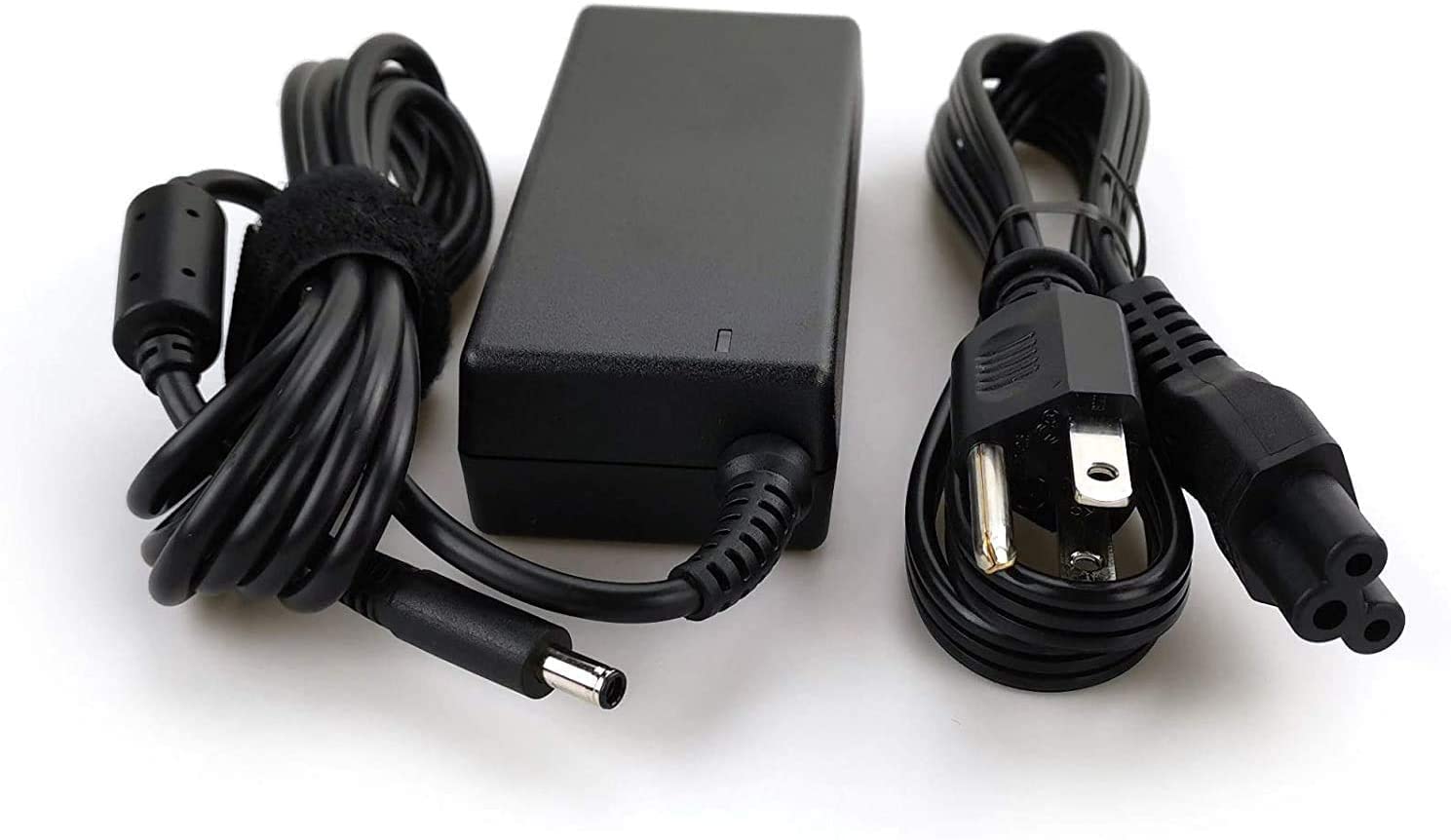 Dell adapter next to laptop for size comparison showing portability benefit