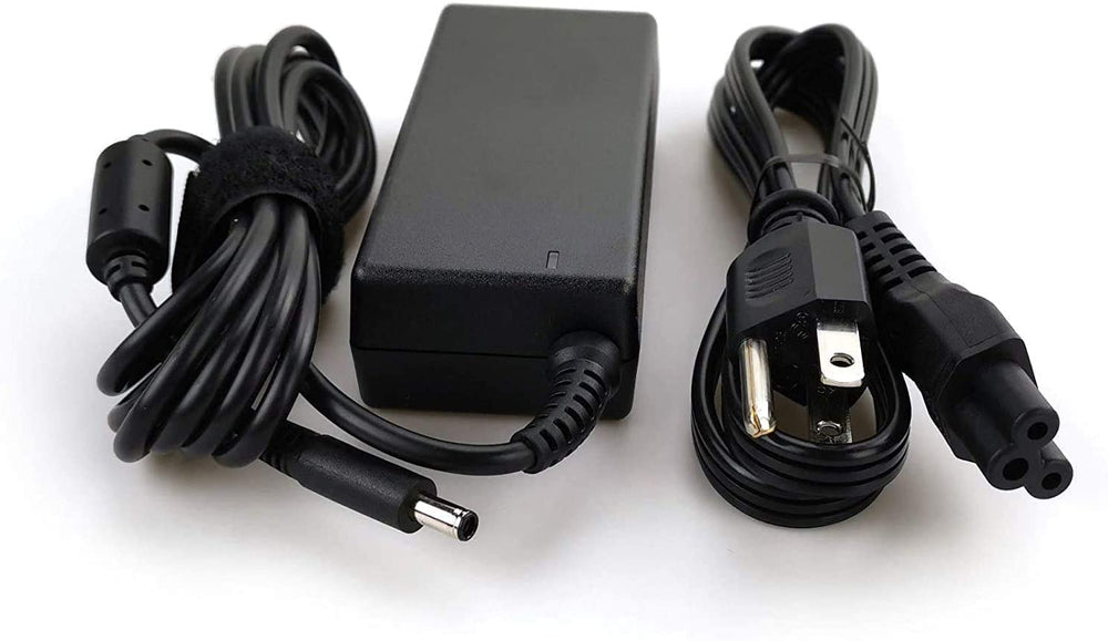 Dell adapter next to laptop for size comparison showing portability benefit
