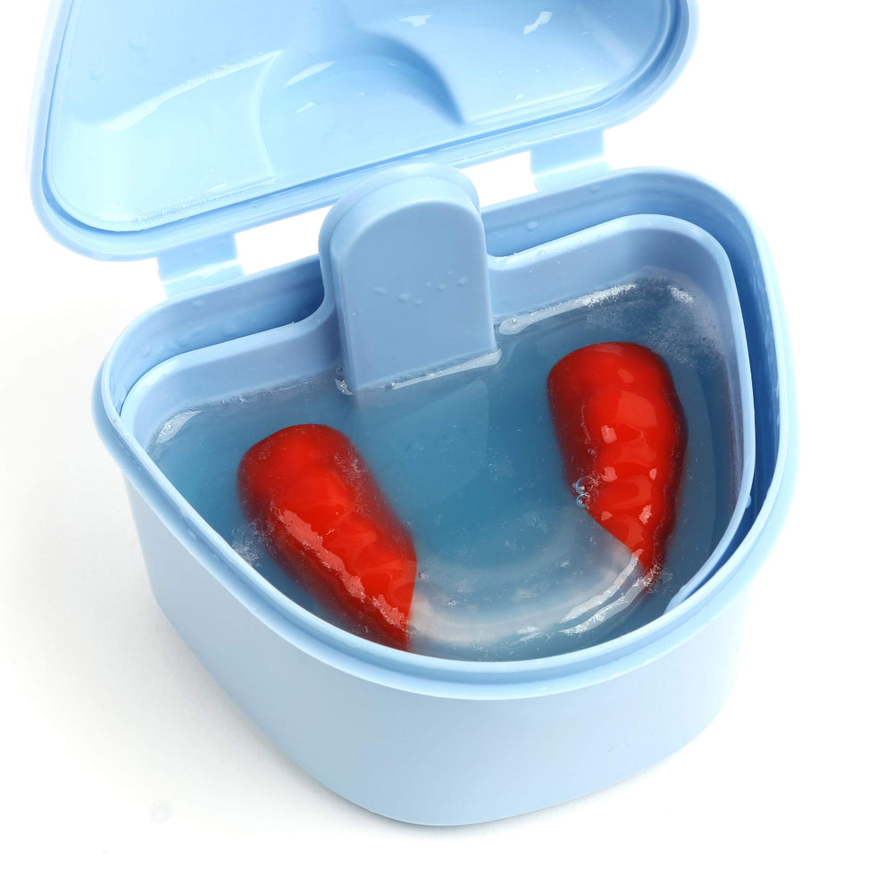 DentaSOAK solution with retainer soaking in cup demonstrating quick 15-minute cleaning benefit