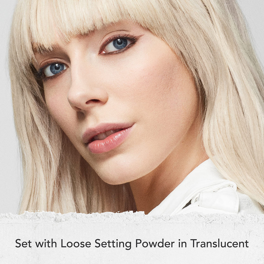 Dermablend translucent powder being applied with brush for longwear hold