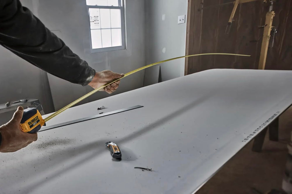 DEWALT 13 ft standout photo showing extended solo measuring reach