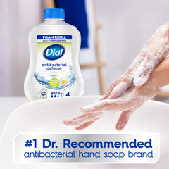 Dial foaming soap being pumped at a kitchen sink for quick cleansing