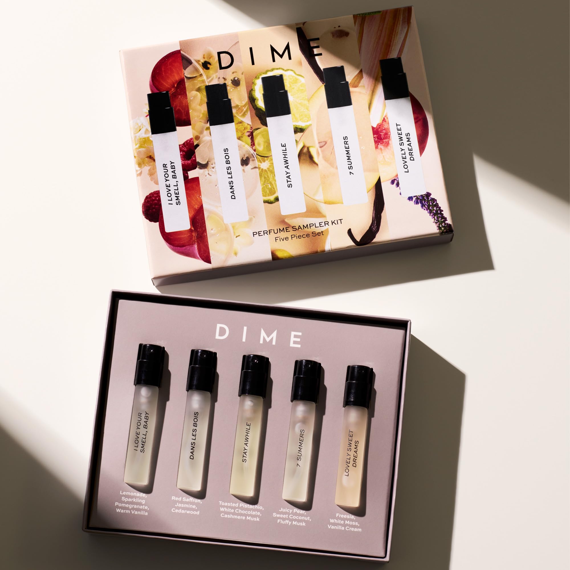 DIME close-up of a 2 ml perfume vial, highlighting the easy-spray applicator benefit