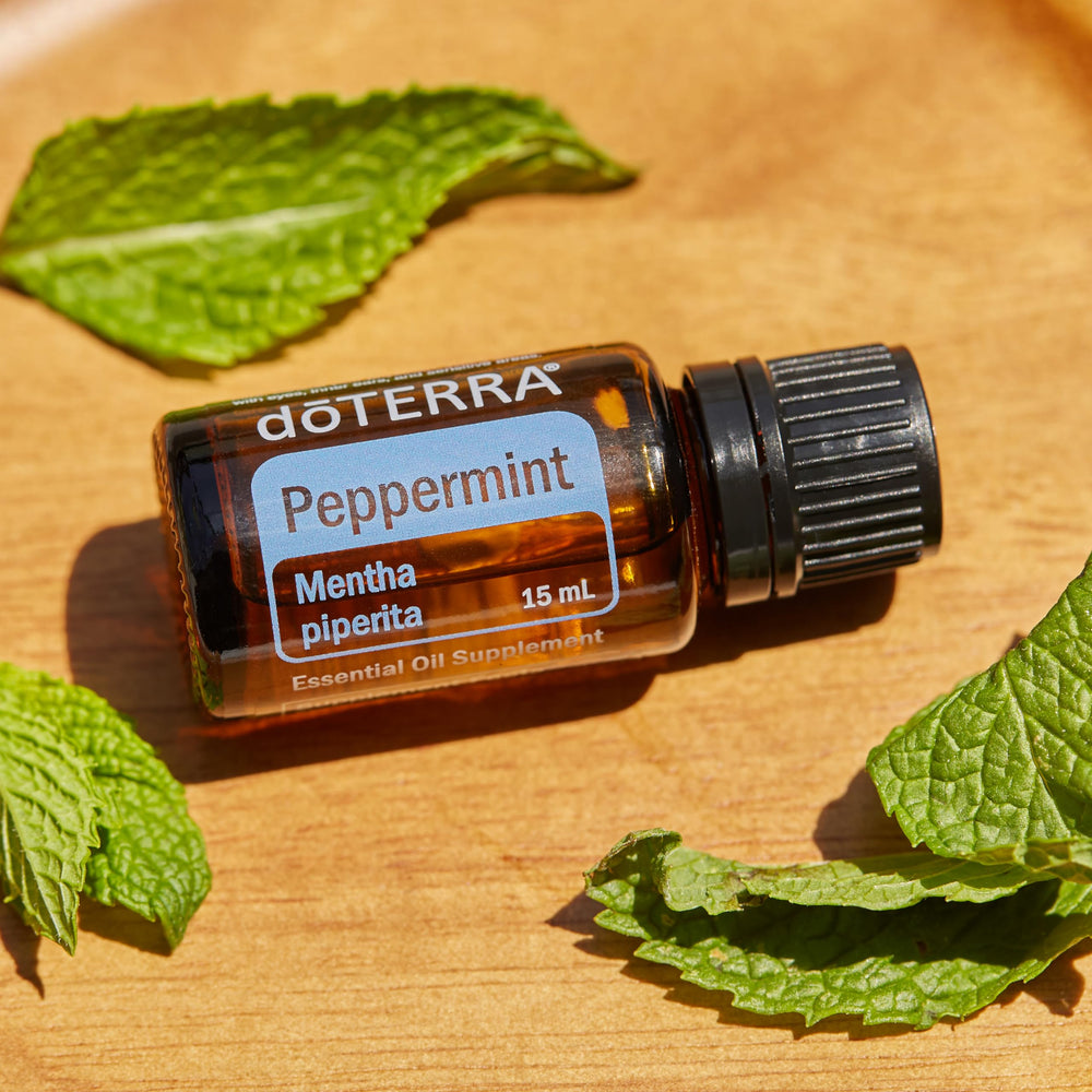 doTERRA peppermint in a diffuser on a shelf creating an invigorating, aromatic room atmosphere