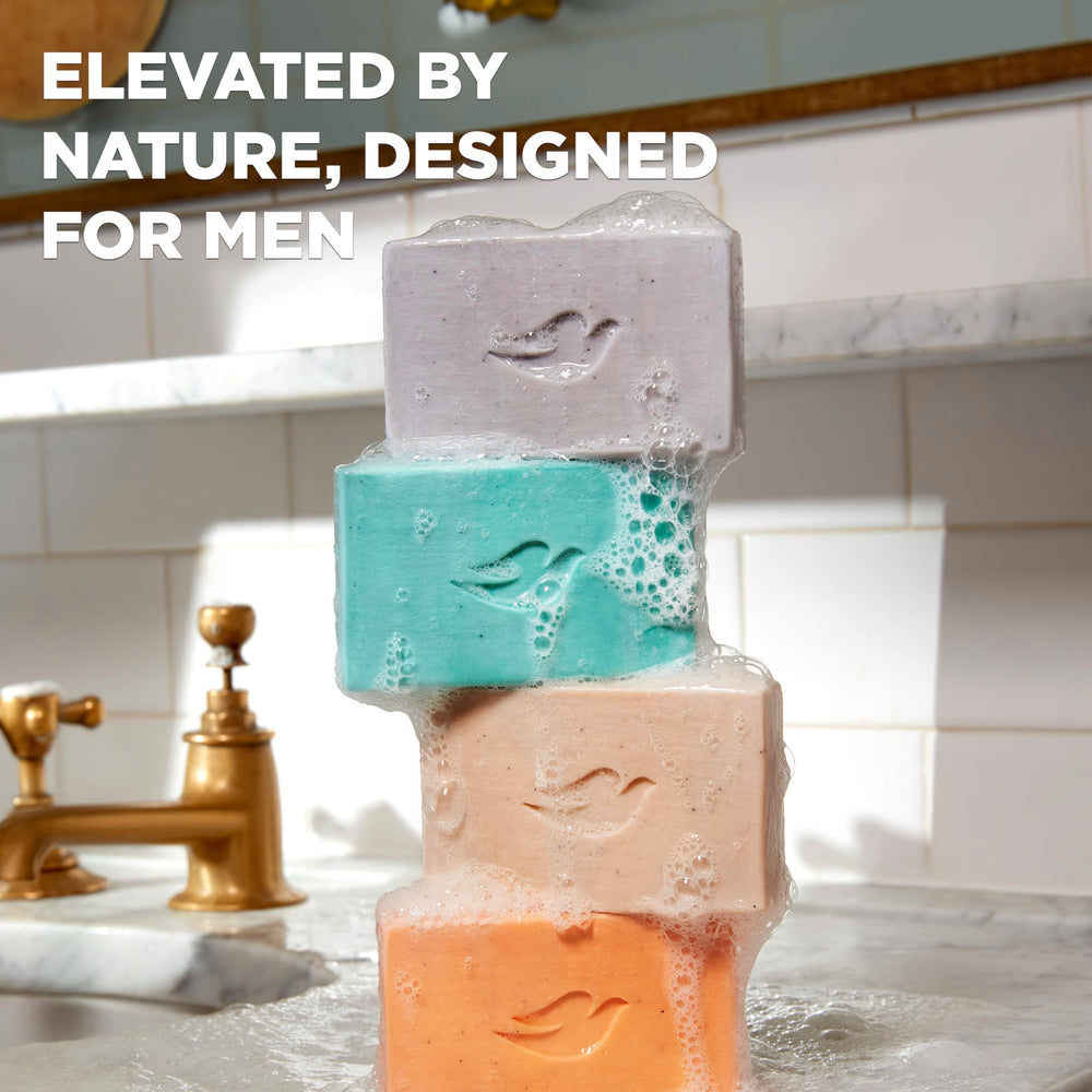 Dove Men+Care bar placed on shower shelf conveying calming scent experience