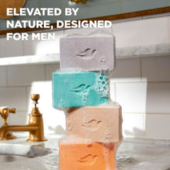Dove Men+Care bar placed on shower shelf conveying calming scent experience