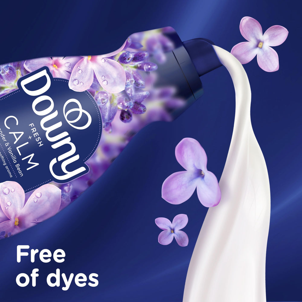Downy bottle beside detergent showing compatibility and aroma layering benefit