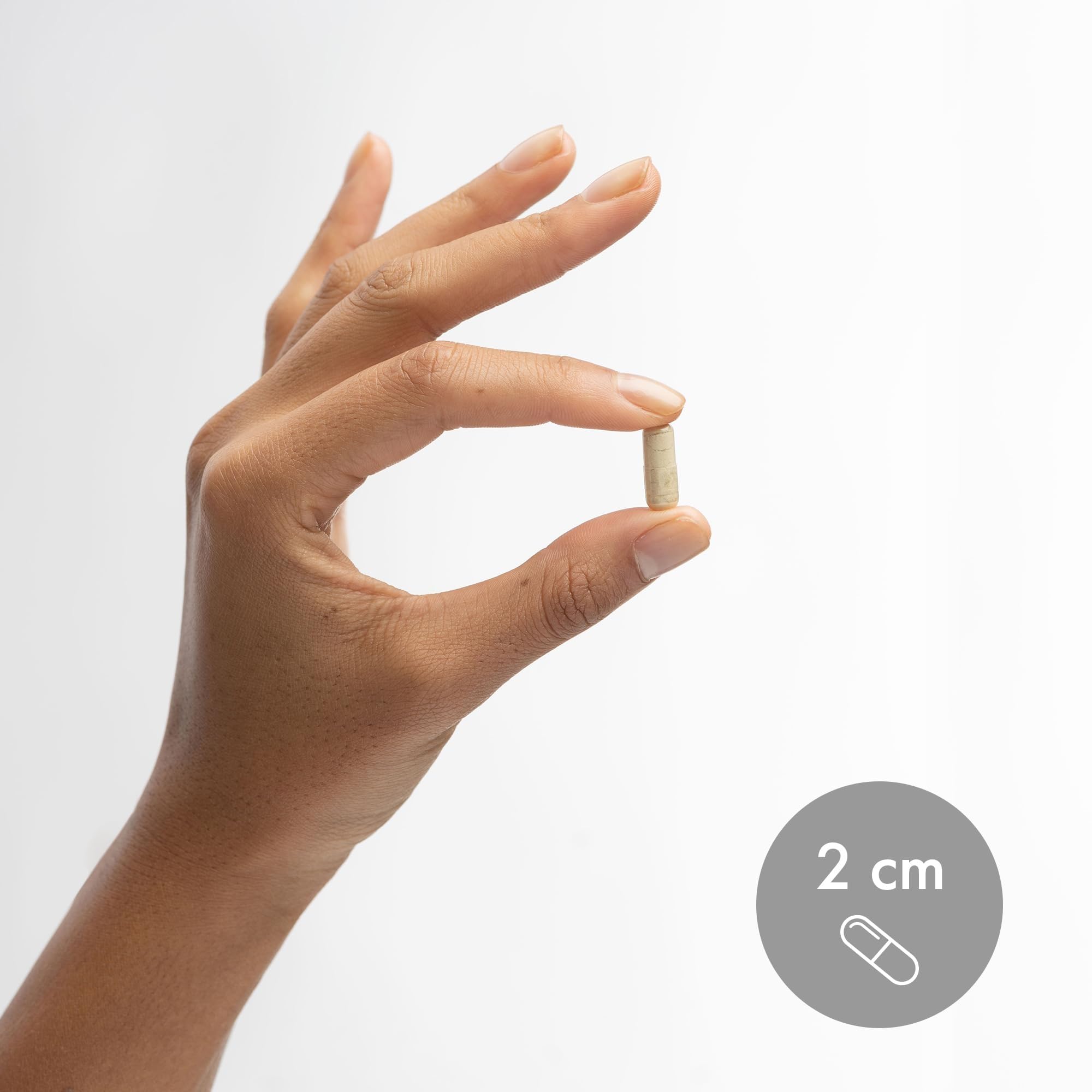 Dr. Mercola zinc plus selenium bottle next to a ruler for clear size and scale comparison