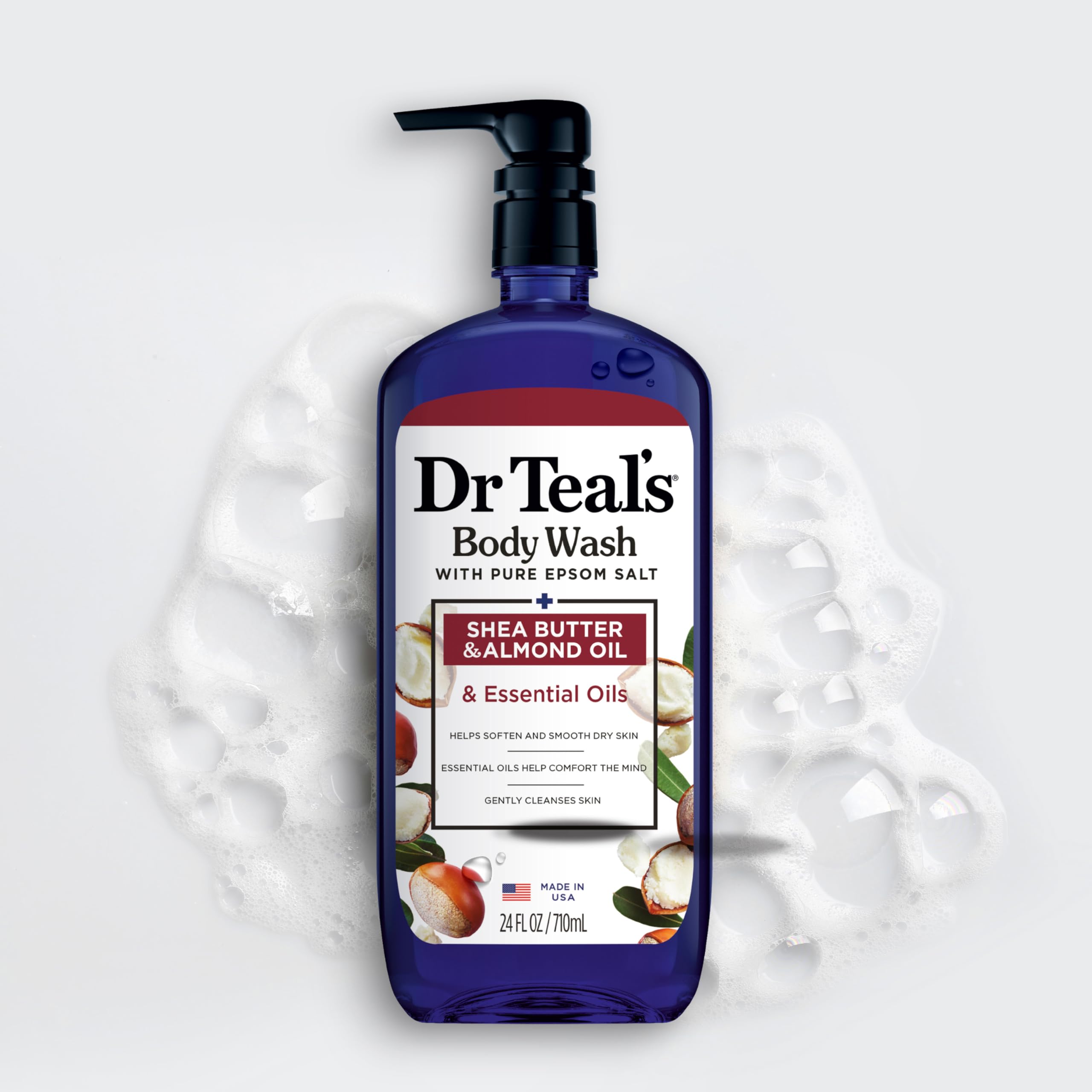 Dr Teal's bottle held in hand to show 24 fl oz size and scale