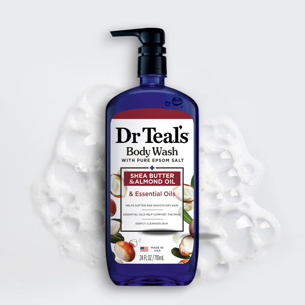 Dr Teal's bottle held in hand to show 24 fl oz size and scale