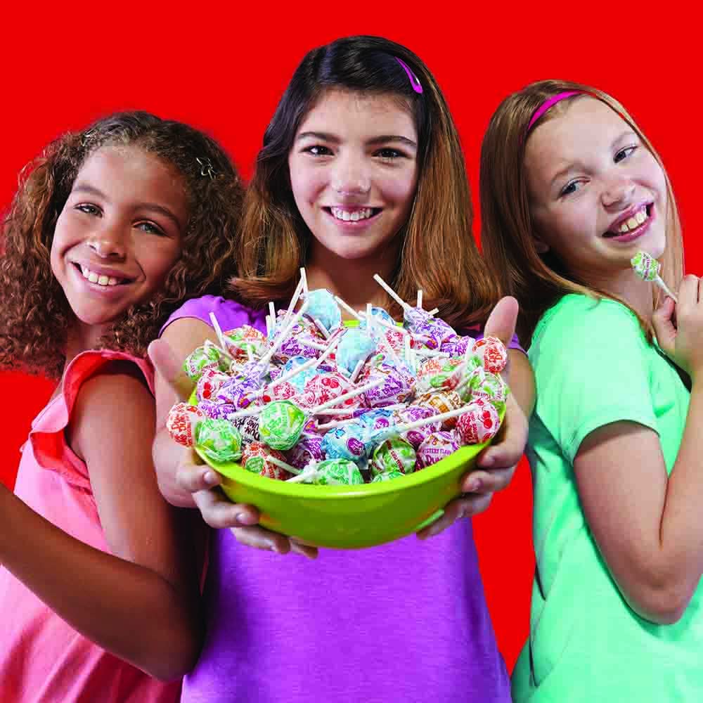 Dum Dums held in hand showing mini size and portion control benefit