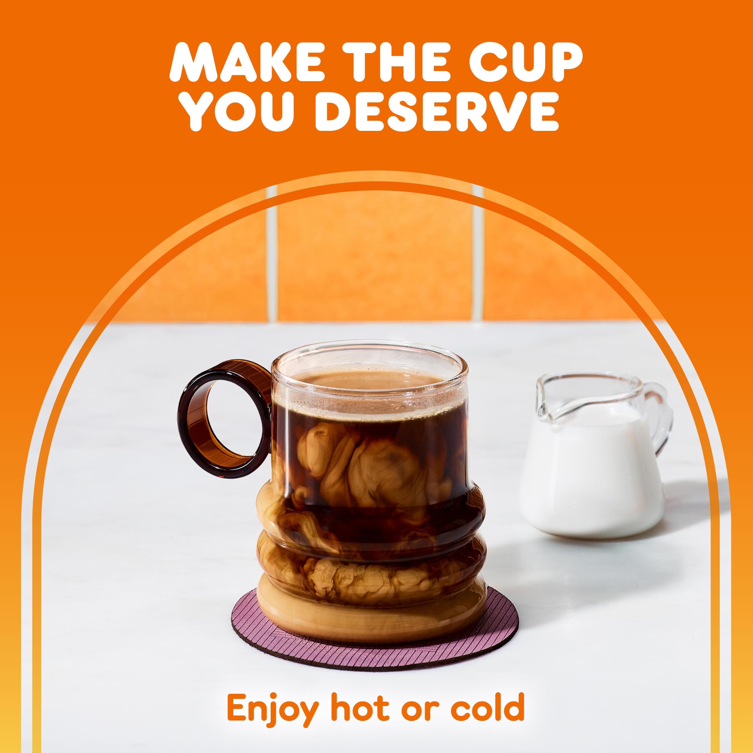 Hand holding a Dunkin' K-Cup for size comparison and portion convenience