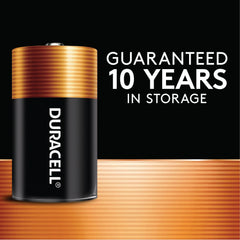 Duracell Coppertop C battery beside a dime showing compact size