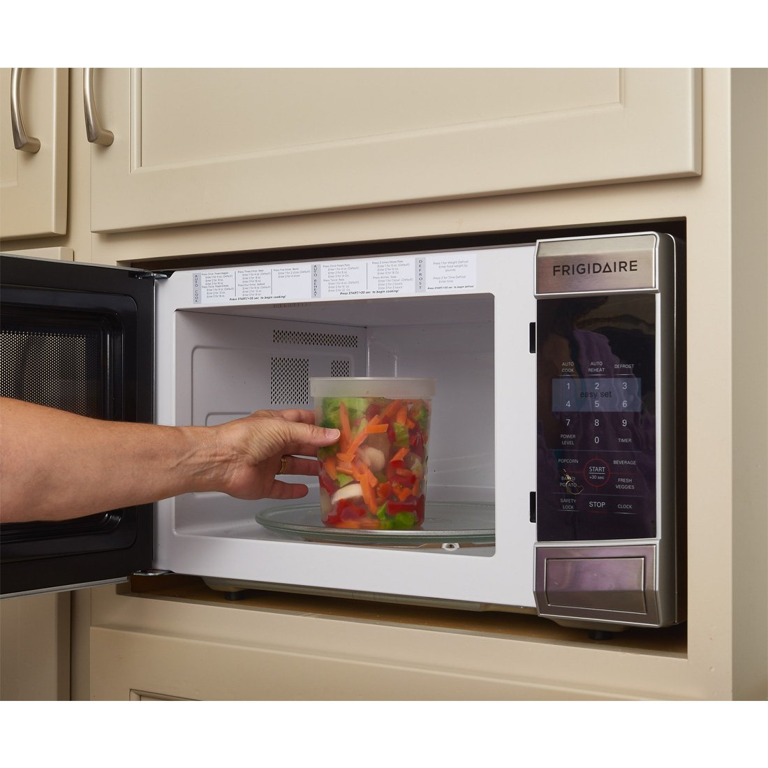 DuraHome container holding hot soup in carrier, demonstrating safe microwave reheat benefit