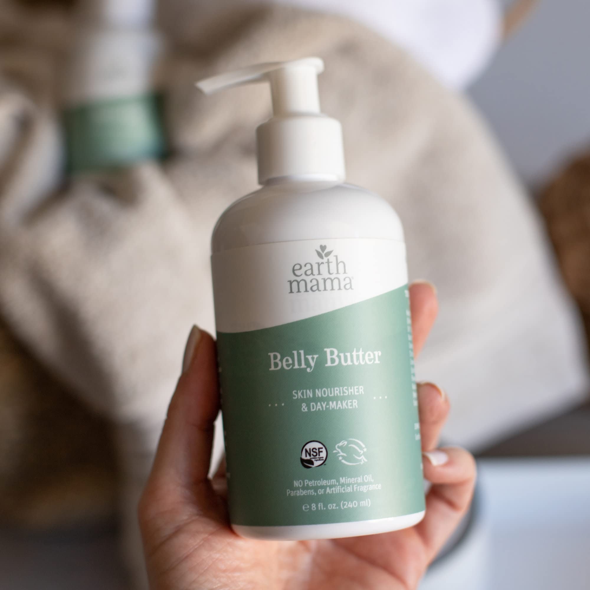 Earth Mama belly butter label closeup showing organic and cruelty-free certifications benefit
