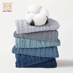 Ease Cubs close-up of muslin texture showing soft cotton weave and gentle touch