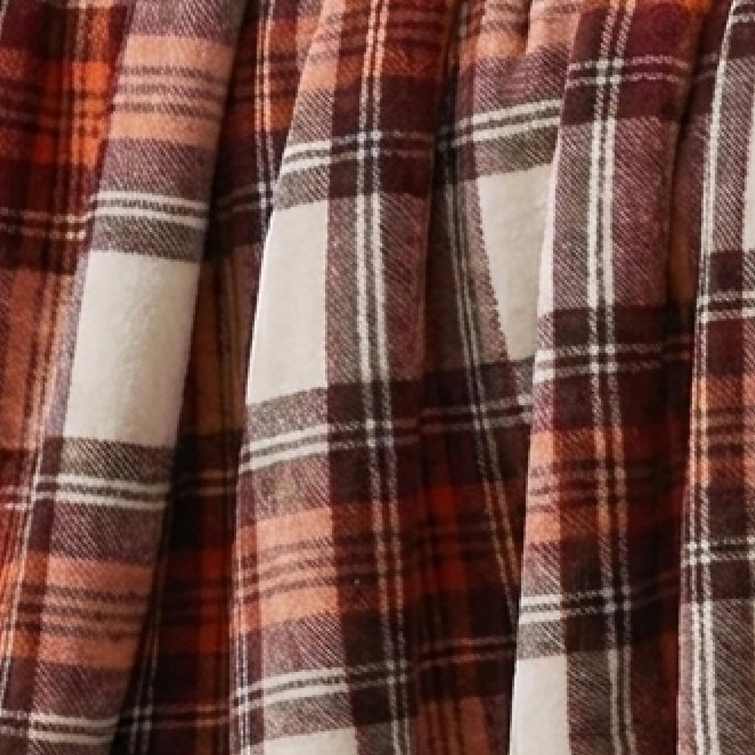 Eddie Bauer throw next to ruler showing 50x60 size for scale and fit