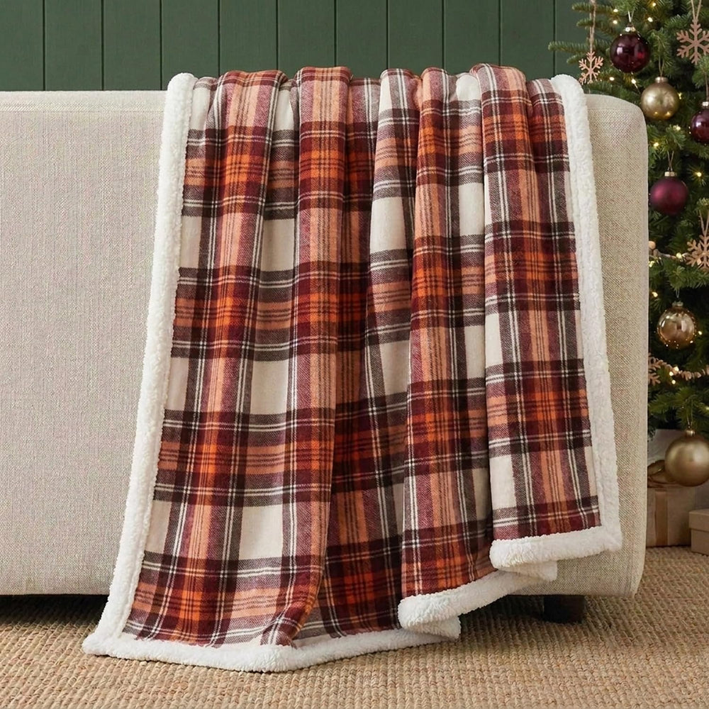 Eddie Bauer throw styled on bed in cabin setting adding rustic warmth