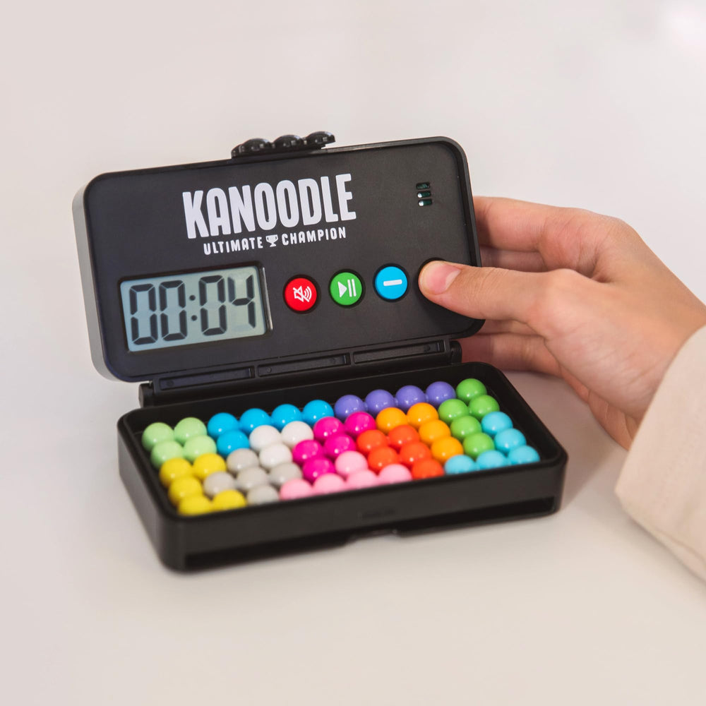 Educational Insights Kanoodle gameplay in hand showing compact, on-the-go use
