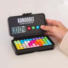 Educational Insights Kanoodle gameplay in hand showing compact, on-the-go use