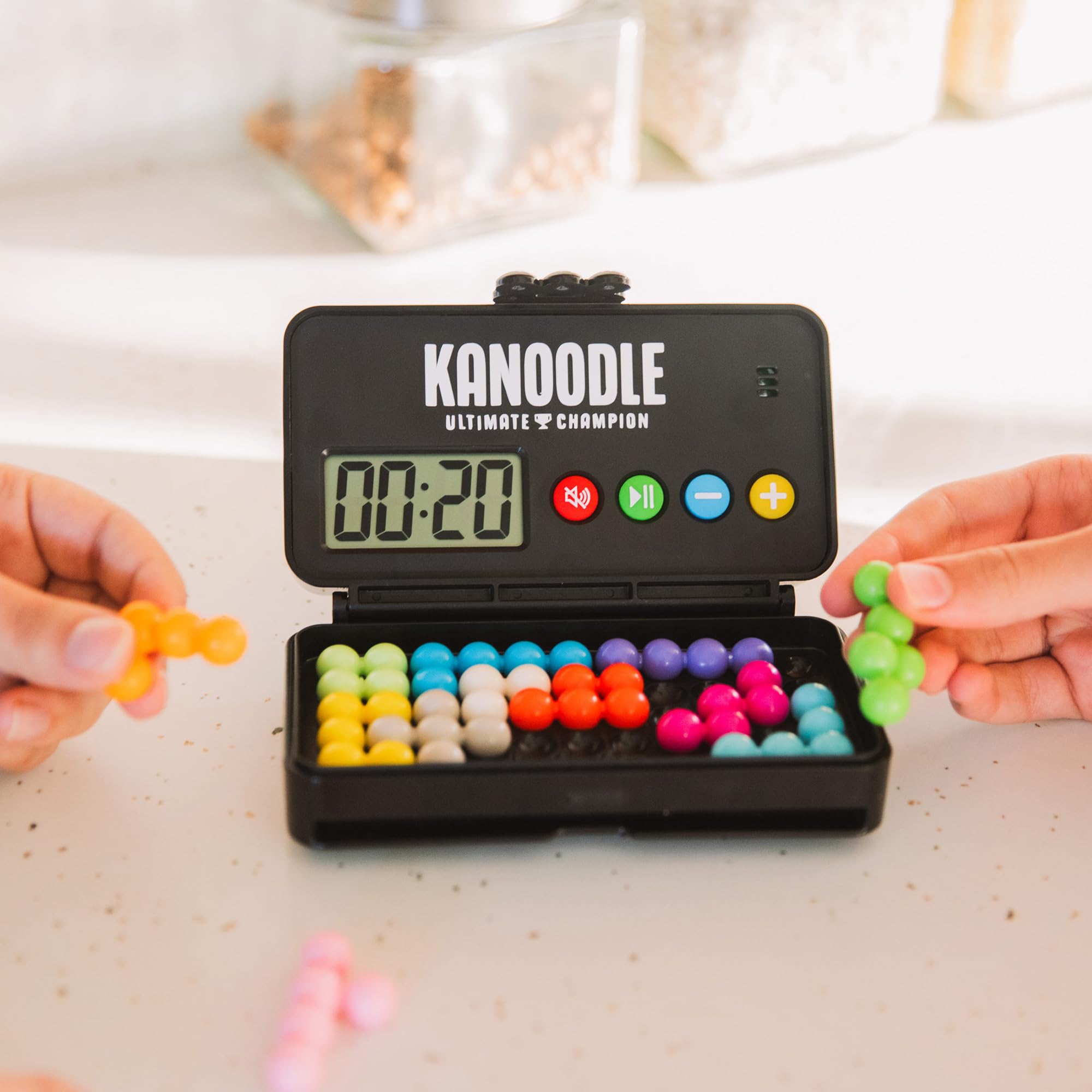 Educational Insights Kanoodle open case layout with organized pieces for travel