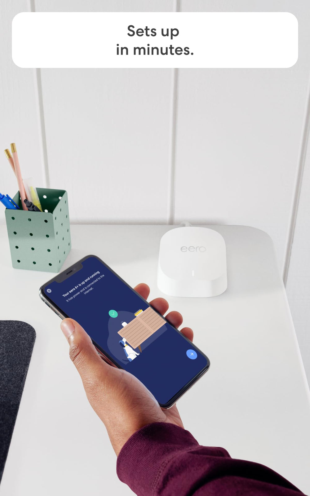 eero next to smartphone showing size and fast connectivity benefit
