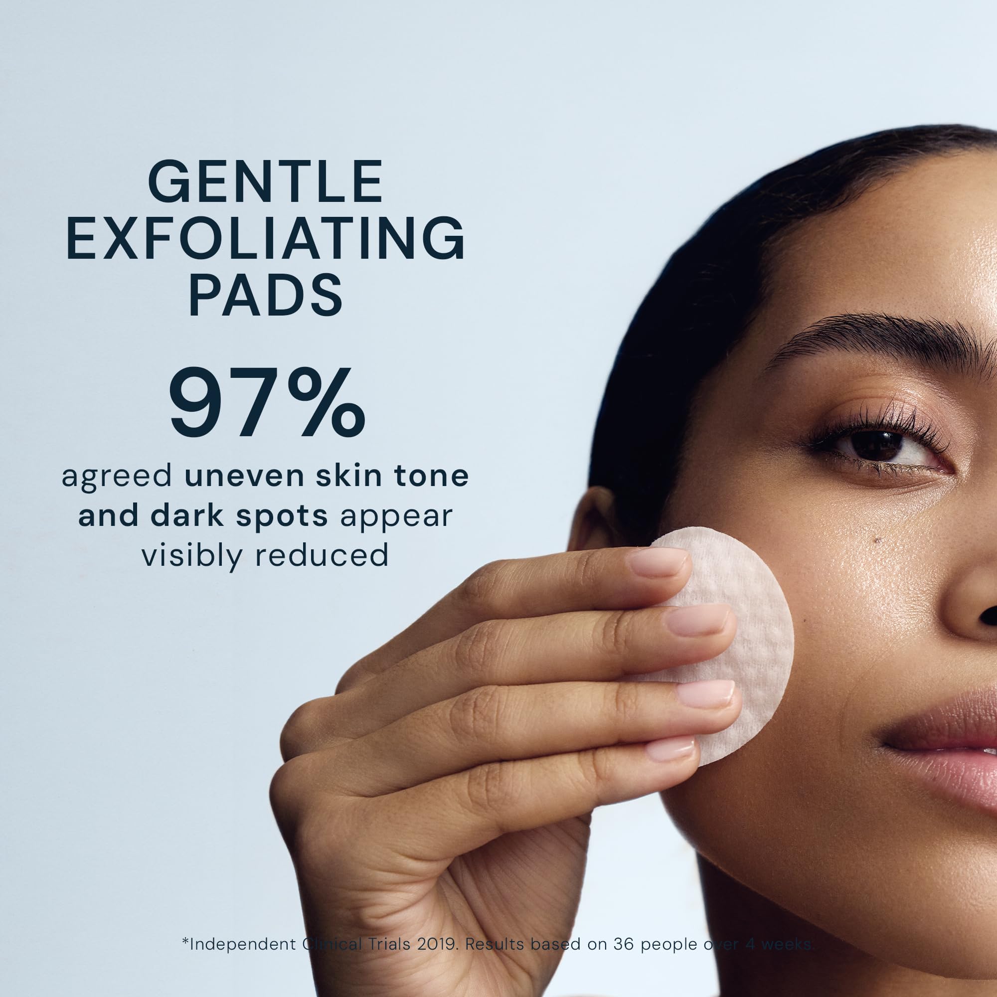 ELEMIS hand holding a pad to show size and travel-friendly convenience