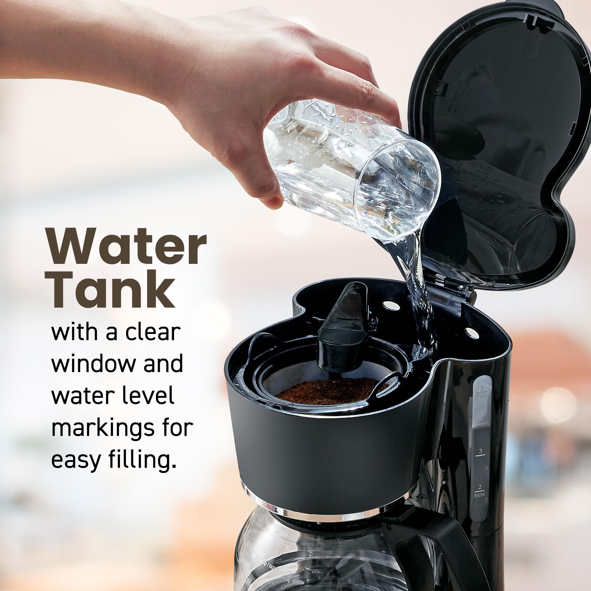 Elite Gourmet glass carafe detail highlighting clear markings for precise serving benefit