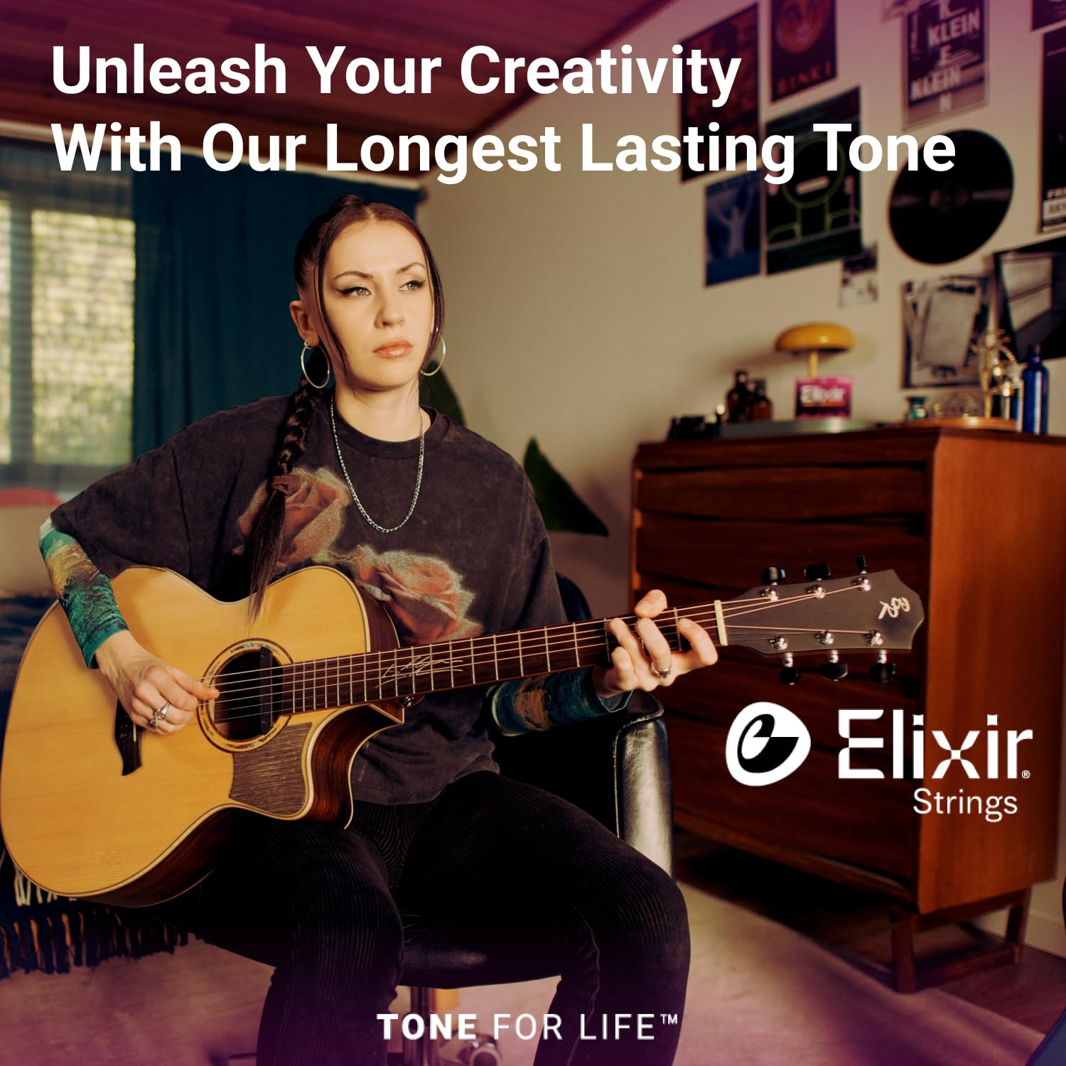 Elixir being played fingerstyle in a living room showing smooth feel and projection