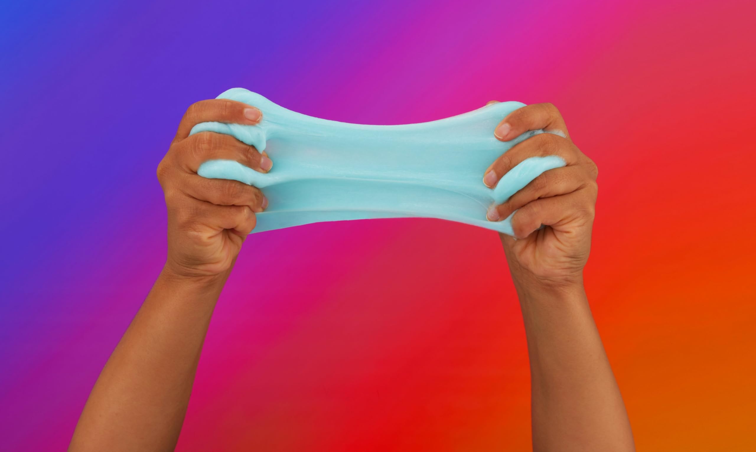 Elmer's clear and color-changing glue bottle close-up, shows labels and pour tip