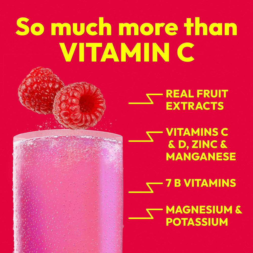 Close-up of Emergen-C Raspberry powder texture demonstrating easy dissolving mix