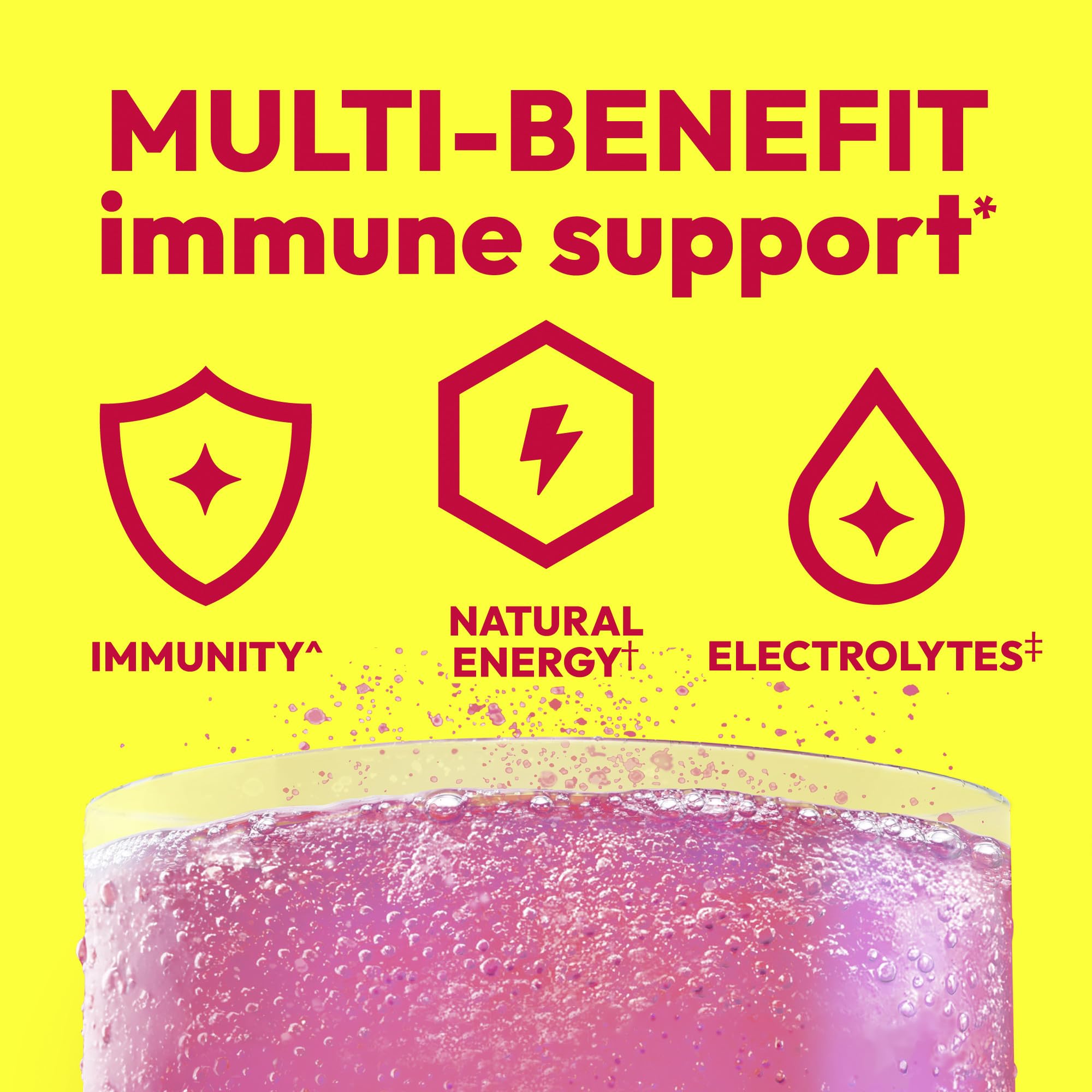 Single Emergen-C Raspberry packet held between fingers, brand and quick dosing visible