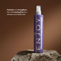 Enjoy conditioning spray nozzle close-up showing fine mist delivery