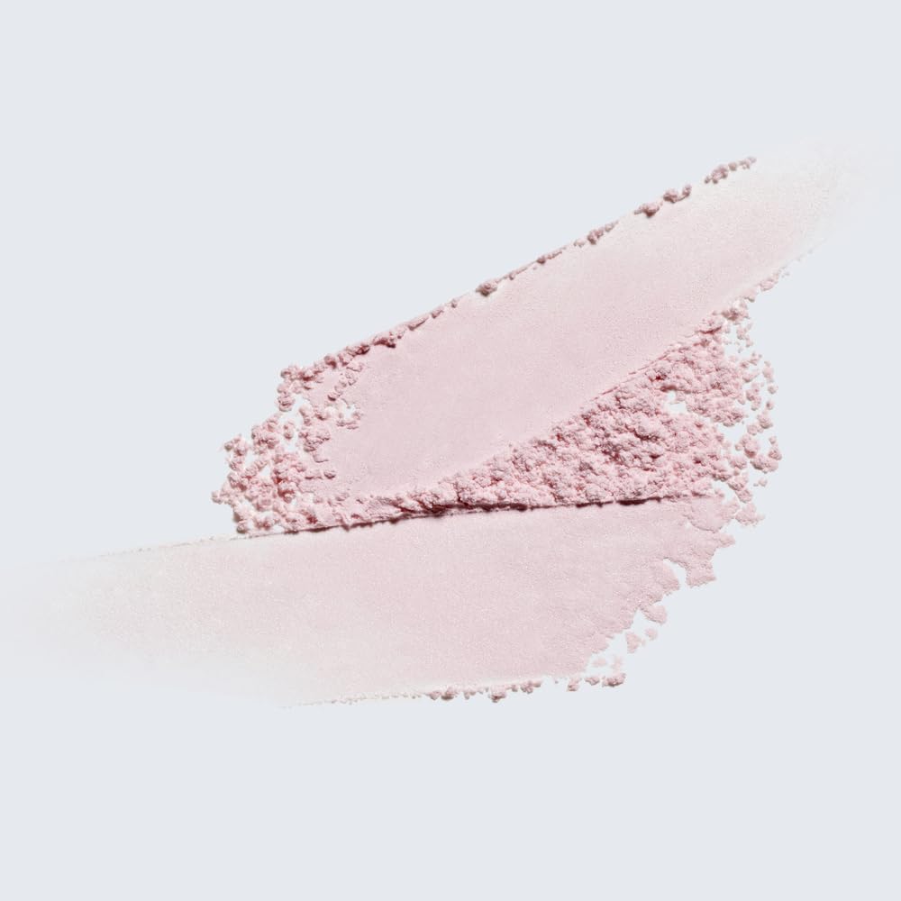 Estée Lauder on vanity with perfume showing layered fragrance styling benefit
