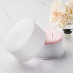 Estée Lauder powder texture close-up showing silky shimmer for luminous skin