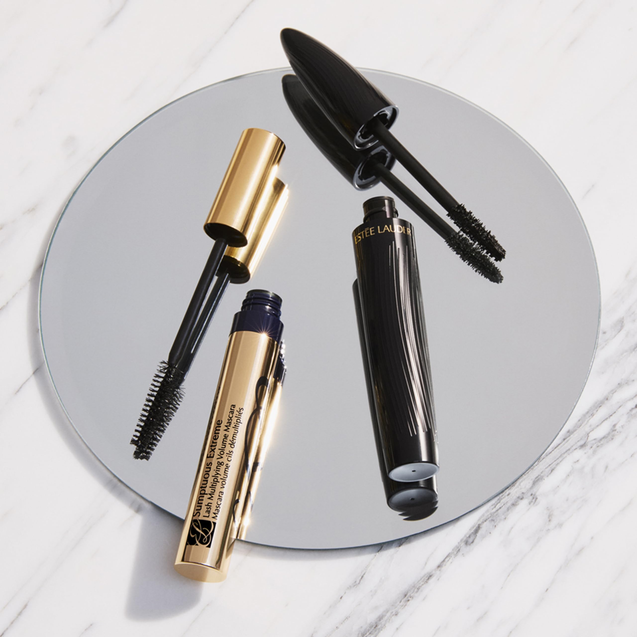 Estée Lauder mascara held in hand to show 0.27 fl oz scale and portability