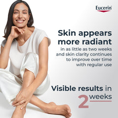 Eucerin tube beside hand for size and scale, useful for travel planning