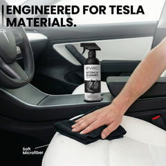 EVEO cleaning spray in use on a Tesla seat removing dirt