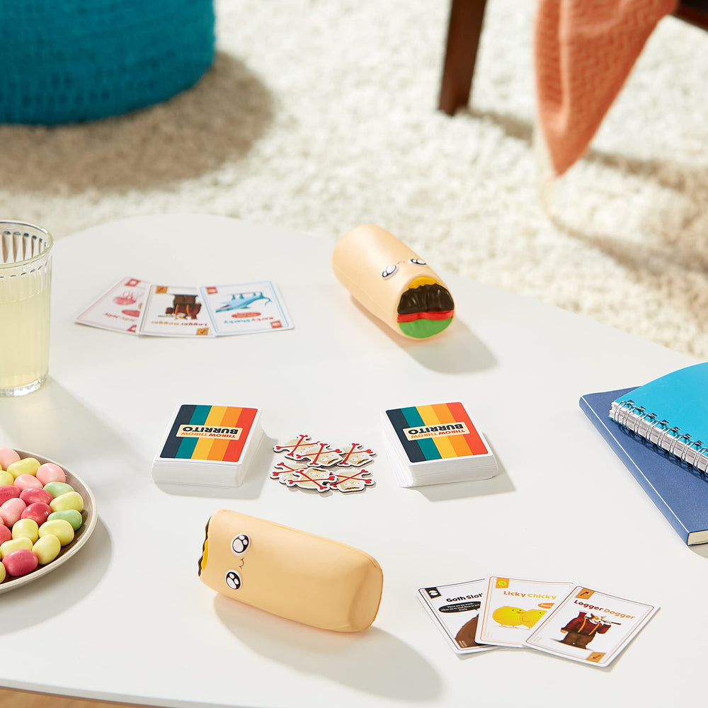 Exploding Kittens components overhead view showing cards, burritos for easy setup