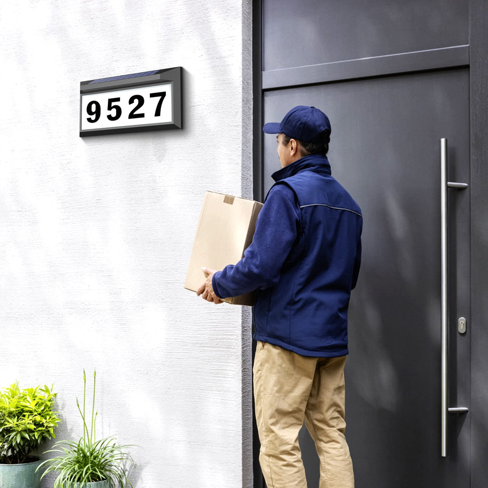 Eyrosa plaque held by hand for scale demonstrating compact, visible size