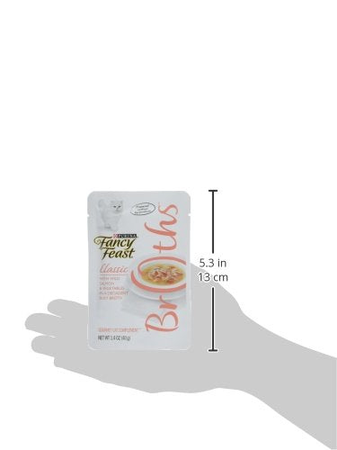 Fancy Feast pouring wild salmon broth over dry kibble to boost flavor