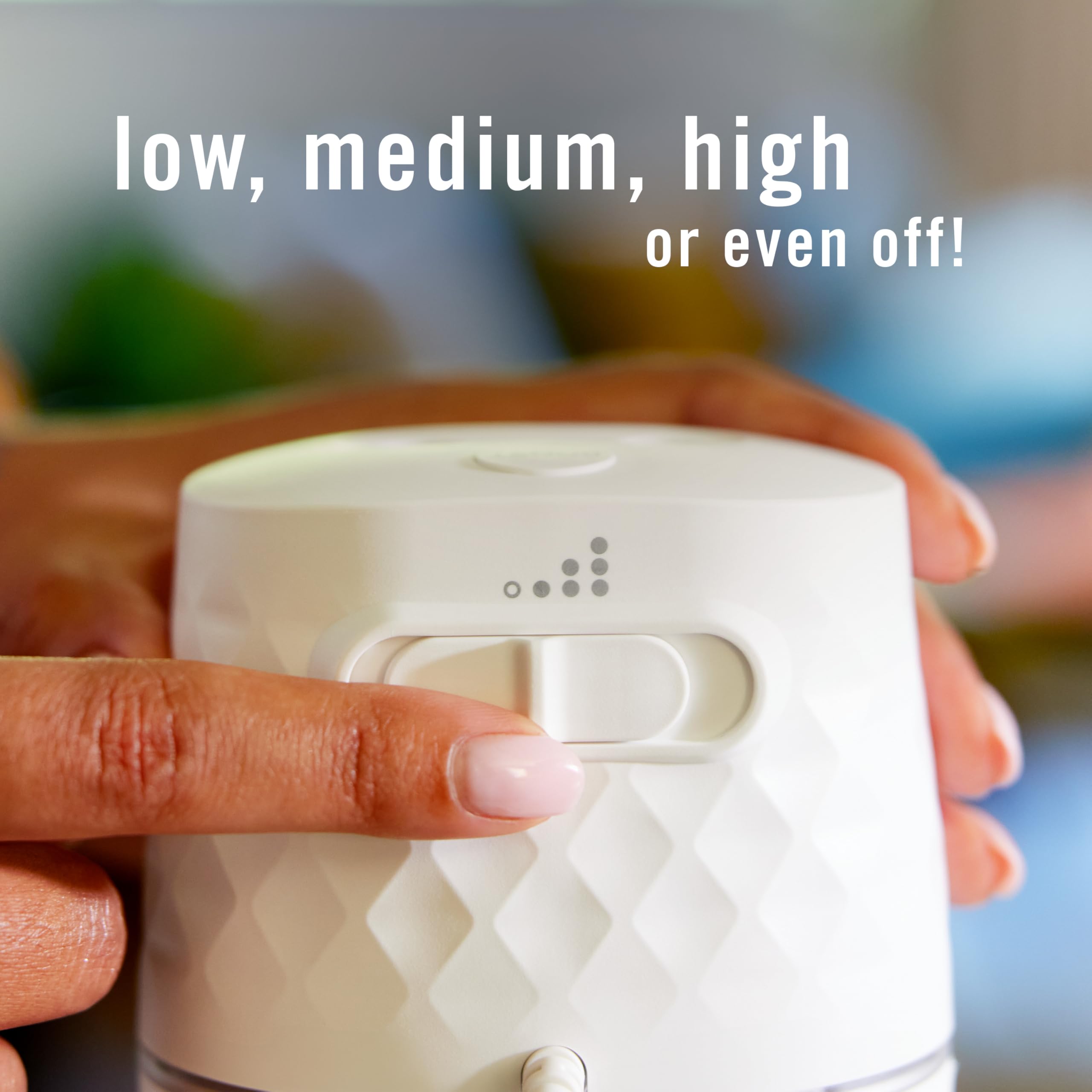 Febreze PLUG placed on a counter using cord for flexible placement and coverage