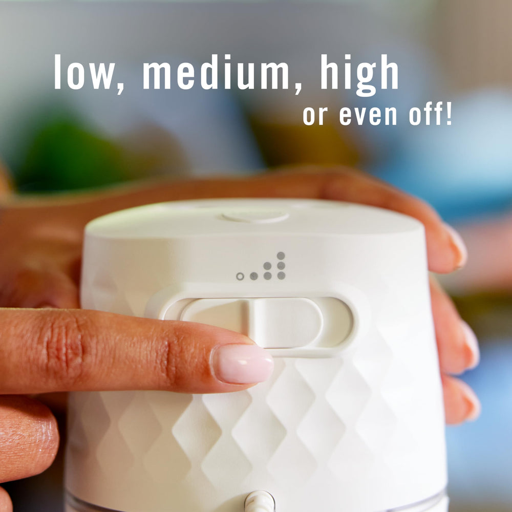 Febreze PLUG placed on a counter using cord for flexible placement and coverage