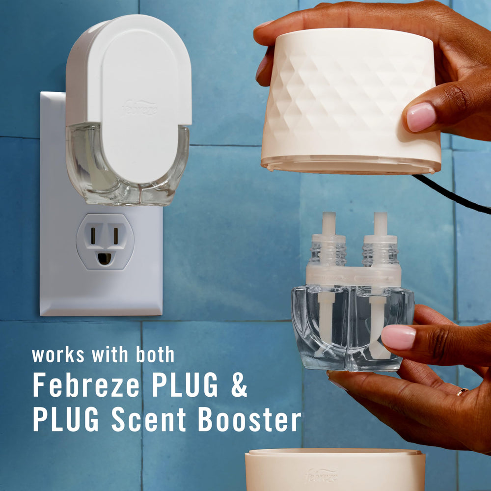 Febreze PLUG refill bottle detail showing label and easy-swap connection
