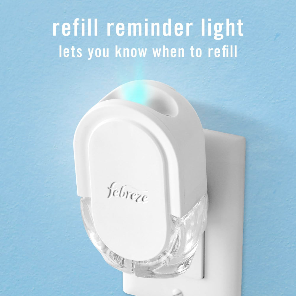 Febreze refill beside coffee mug showing compact size and practical scale